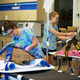 During TPN treatments, turtle patients are balanced on swimming noodles to prevent damage to their internal organs, and are strapped to the treatment table with donated (used) racecar harnesses. Photo Credit: Loggerhead Marinelife Center